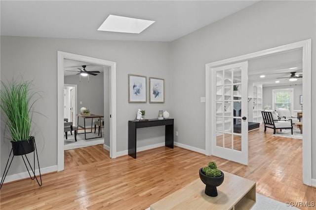 2941 Ellesmere Dr, Midlothian, VA 23113 - living area featuring lofted ceiling, ceiling fan, light wood-style floors, and a skylight