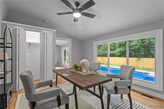 2941 Ellesmere Dr, Midlothian, VA 23113 - home office with vaulted ceiling, plenty of natural light, light wood-style flooring, and a ceiling fan
