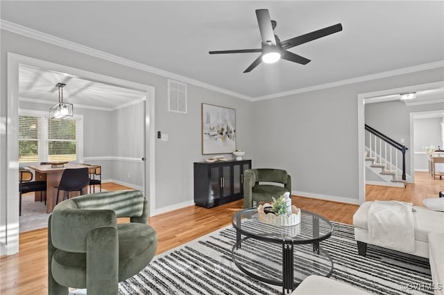 2941 Ellesmere Dr, Midlothian, VA 23113 - living area featuring light wood-style floors, crown molding, stairs, and a ceiling fan