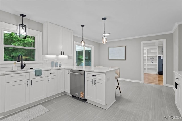 2941 Ellesmere Dr, Midlothian, VA 23113 - kitchen featuring dishwasher, white cabinetry, a peninsula, ornamental molding, and pendant lighting