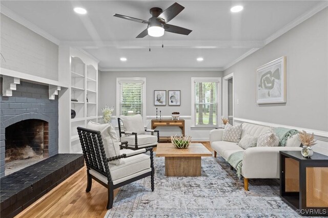 2941 Ellesmere Dr, Midlothian, VA 23113 - living room with wood finished floors, crown molding, plenty of natural light, recessed lighting, and a brick fireplace