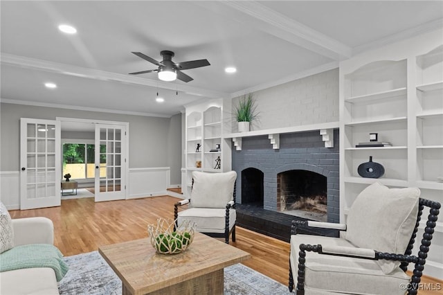 2941 Ellesmere Dr, Midlothian, VA 23113 - living area featuring french doors, crown molding, built in shelves, a ceiling fan, and wood finished floors