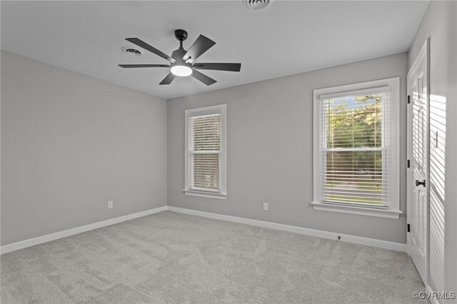 2941 Ellesmere Dr, Midlothian, VA 23113 - spare room featuring light carpet, plenty of natural light, and ceiling fan