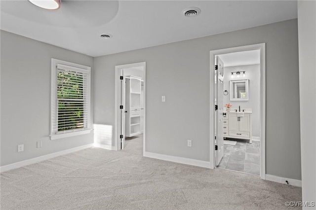 2941 Ellesmere Dr, Midlothian, VA 23113 - unfurnished bedroom with carpet floors, a walk in closet, and ensuite bath