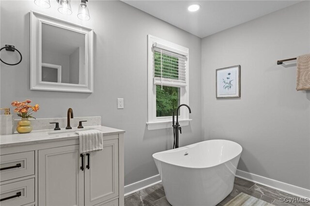 2941 Ellesmere Dr, Midlothian, VA 23113 - bathroom featuring a freestanding tub and vanity