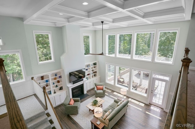 8300 Mckibben Dr, Chesterfield, VA 23838 - living room with beam ceiling, a fireplace with flush hearth, coffered ceiling, and wood finished floors