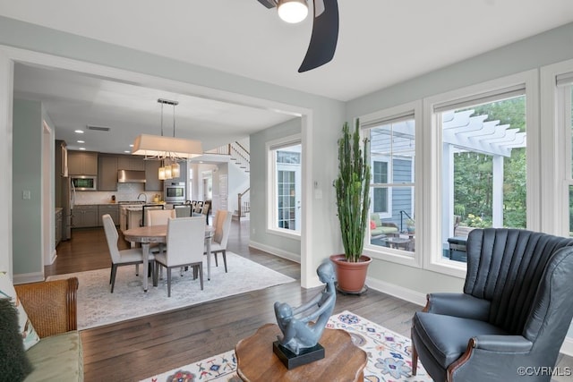 8300 Mckibben Dr, Chesterfield, VA 23838 - living area featuring plenty of natural light, dark wood-type flooring, stairway, a chandelier, and recessed lighting