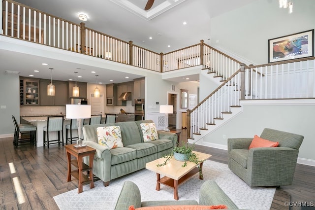 8300 Mckibben Dr, Chesterfield, VA 23838 - living room featuring dark wood-style flooring, stairs, a towering ceiling, recessed lighting, and a ceiling fan