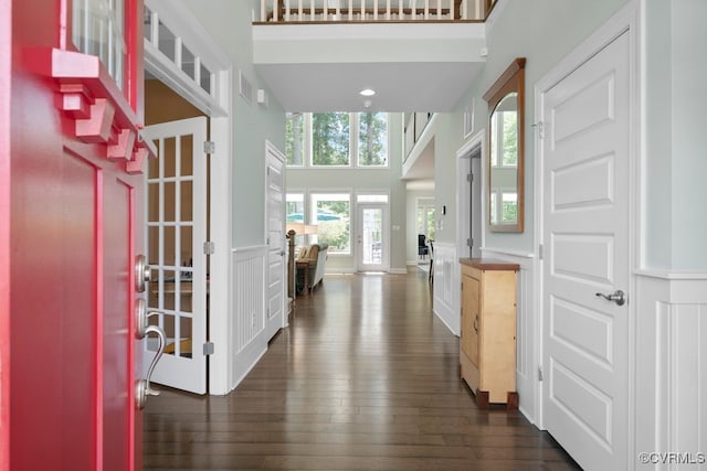 8300 Mckibben Dr, Chesterfield, VA 23838 - foyer entrance featuring a high ceiling, a decorative wall, dark wood-style floors, and wainscoting