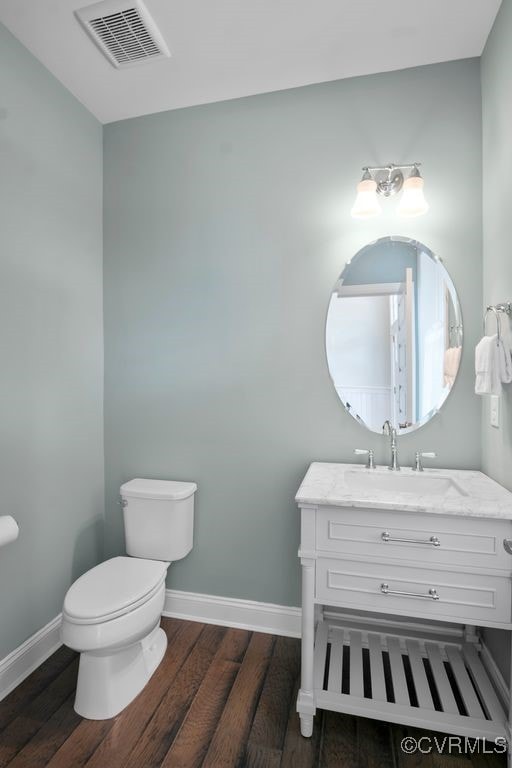 8300 Mckibben Dr, Chesterfield, VA 23838 - half bath featuring wood finished floors and vanity