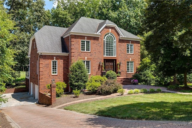 11916 Brookmeade Ct, Glen Allen, VA 23059 - georgian-style home with driveway, brick siding, a front lawn, an attached garage, and roof with shingles