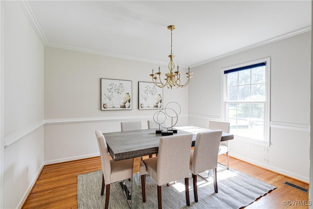 206 Northgate Ct, North Chesterfield, VA 23236 - dining area featuring a chandelier, ornamental molding, light wood-type flooring, and healthy amount of natural light