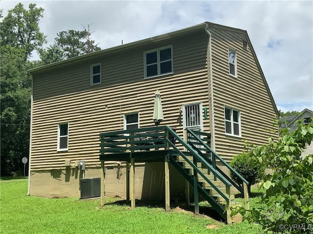 12400 Richmond St, Chesterfield, VA 23831 - rear view of house featuring stairway, a deck, and a lawn