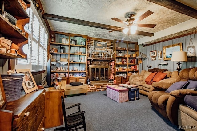 25014 James Ave, Dinwiddie, VA 23803 - living area with a textured ceiling, carpet flooring, ceiling fan, beam ceiling, and wooden walls