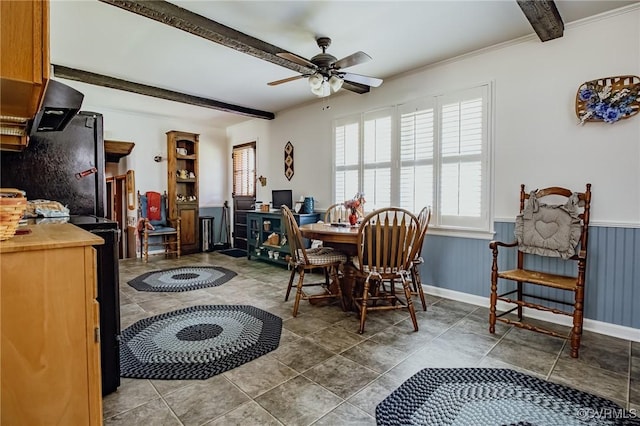 25014 James Ave, Dinwiddie, VA 23803 - tiled dining room with healthy amount of natural light, ceiling fan, beamed ceiling, and wainscoting