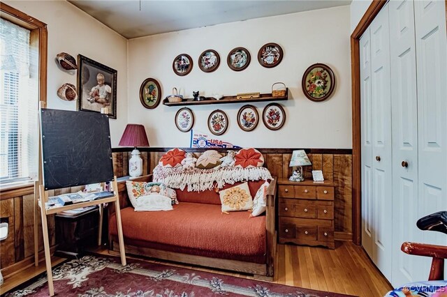 25014 James Ave, Dinwiddie, VA 23803 - bedroom with wood finished floors, a wainscoted wall, a closet, and wooden walls