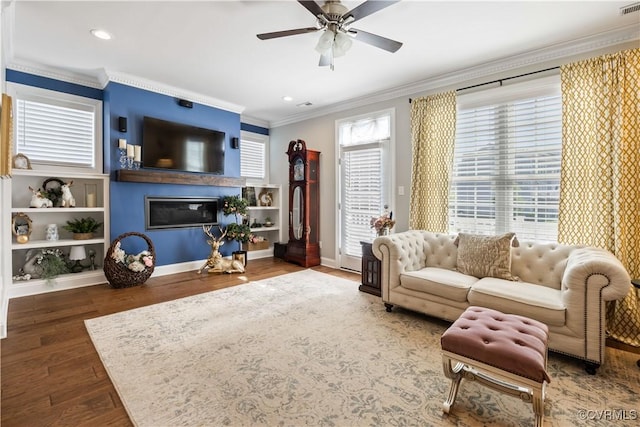14432 Michaux Village Dr, Midlothian, VA 23113 - living area featuring crown molding, a ceiling fan, wood finished floors, a glass covered fireplace, and recessed lighting