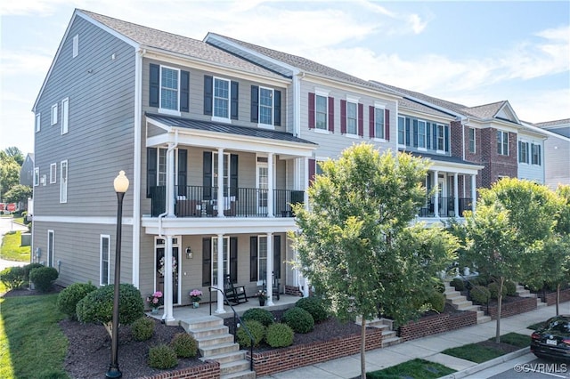 14432 Michaux Village Dr, Midlothian, VA 23113 - view of property featuring a porch, a balcony, a standing seam roof, a metal roof, and stairway