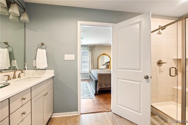 14432 Michaux Village Dr, Midlothian, VA 23113 - ensuite bathroom with vanity, a shower stall, and wood finished floors