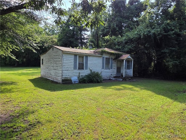15044 Tidewater Trl, Caret, VA 22436 - view of front of home featuring a front lawn and a metal roof