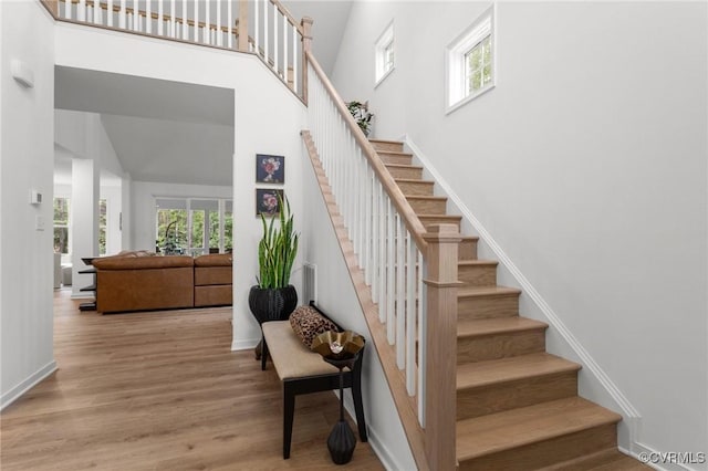 8507 Mckibben Dr, Chesterfield, VA 23838 - staircase with a towering ceiling and wood finished floors