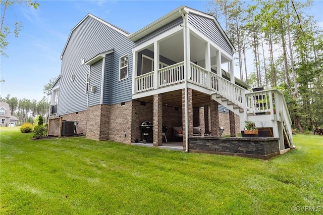 8507 Mckibben Dr, Chesterfield, VA 23838 - back of house featuring a lawn, a wooden deck, a patio, stairway, and brick siding