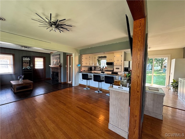 7360 Ford Ave, Mechanicsville, VA 23111 - living room featuring a fireplace and dark wood-type flooring