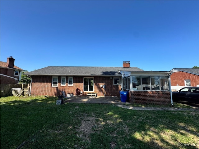 7360 Ford Ave, Mechanicsville, VA 23111 - back of house featuring entry steps, brick siding, a chimney, and a patio