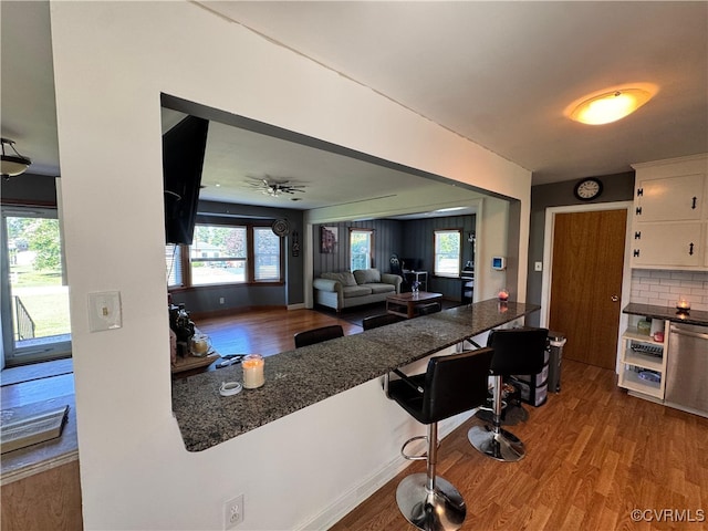 7360 Ford Ave, Mechanicsville, VA 23111 - kitchen with wood finished floors, white cabinetry, and plenty of natural light