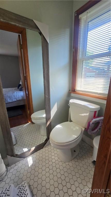 7360 Ford Ave, Mechanicsville, VA 23111 - ensuite bathroom featuring toilet and baseboards