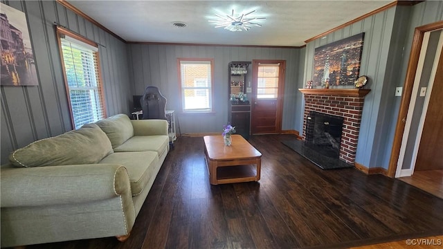 7360 Ford Ave, Mechanicsville, VA 23111 - living room featuring crown molding, wood finished floors, a brick fireplace, and healthy amount of natural light