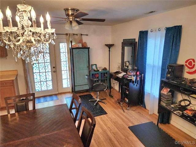 5724 Linda Rd, Sandston, VA 23150 - dining room with wood finished floors, a ceiling fan, and a chandelier