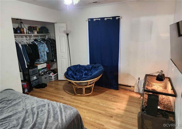 5724 Linda Rd, Sandston, VA 23150 - bedroom with baseboard heating, wood finished floors, and a closet
