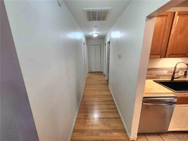 5724 Linda Rd, Sandston, VA 23150 - hallway featuring a sink and light wood-type flooring