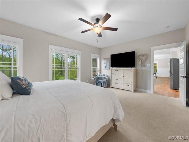 1270 Mill Quarter Rd, Powhatan, VA 23139 - bedroom featuring freestanding refrigerator, multiple windows, light colored carpet, and a ceiling fan