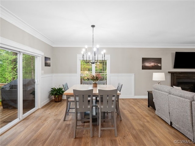 1270 Mill Quarter Rd, Powhatan, VA 23139 - dining room featuring a chandelier, light wood-style flooring, crown molding, a fireplace, and a wainscoted wall