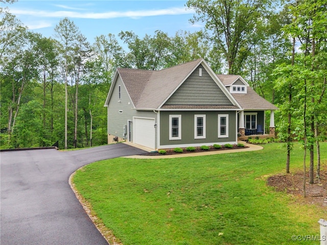 1270 Mill Quarter Rd, Powhatan, VA 23139 - craftsman house featuring driveway, a garage, a front yard, covered porch, and a shingled roof