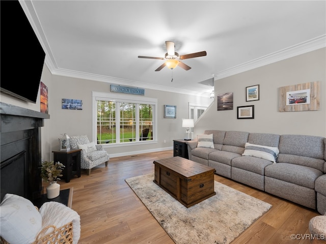 1270 Mill Quarter Rd, Powhatan, VA 23139 - living room with a ceiling fan, crown molding, a fireplace, and light wood-style flooring