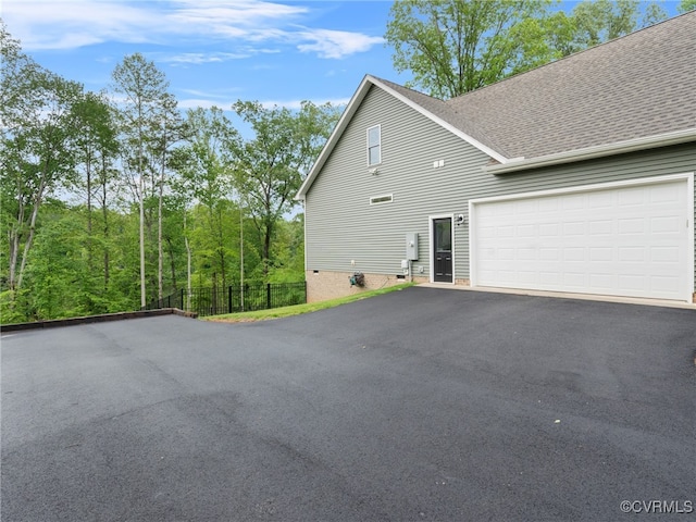 1270 Mill Quarter Rd, Powhatan, VA 23139 - view of side of property featuring asphalt driveway, a shingled roof, and an attached garage