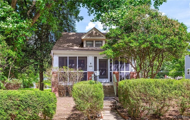 3825 Benton Ave, Henrico, VA 23222 - view of front of house with a sunroom, stairway, and a shingled roof