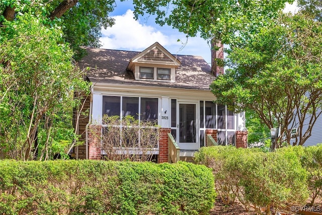 3825 Benton Ave, Henrico, VA 23222 - view of front of home featuring a sunroom, a chimney, and a shingled roof