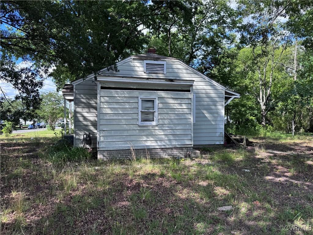 1601 N 25th St, Richmond, VA 23223 - view of side of home featuring an outbuilding