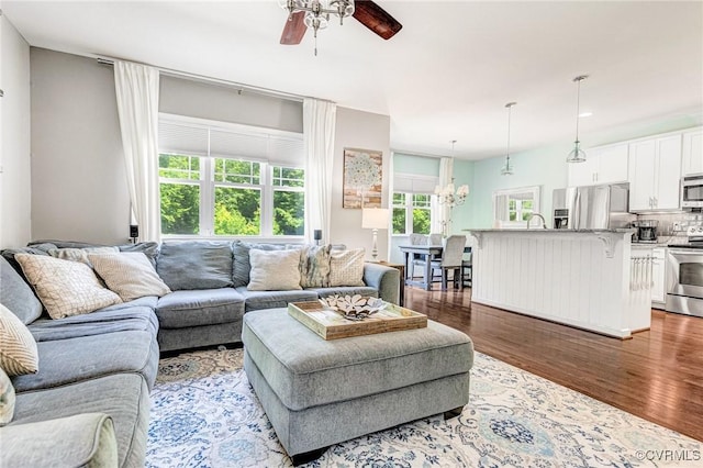8300 Badestowe Ct, Chesterfield, VA 23832 - living room with ceiling fan, wood finished floors, and a chandelier