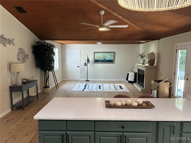 111 New S Rd, Lancaster, VA 22482 - living room with ceiling fan, light wood-style flooring, wooden ceiling, and a fireplace