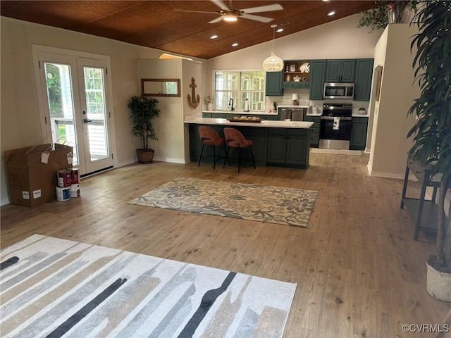 111 New S Rd, Lancaster, VA 22482 - kitchen with appliances with stainless steel finishes, a peninsula, open shelves, a ceiling fan, and green cabinets