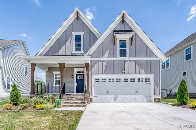 10698 Skippers St, Glen Allen, VA 23059 - view of front of property with board and batten siding, a porch, concrete driveway, and a garage