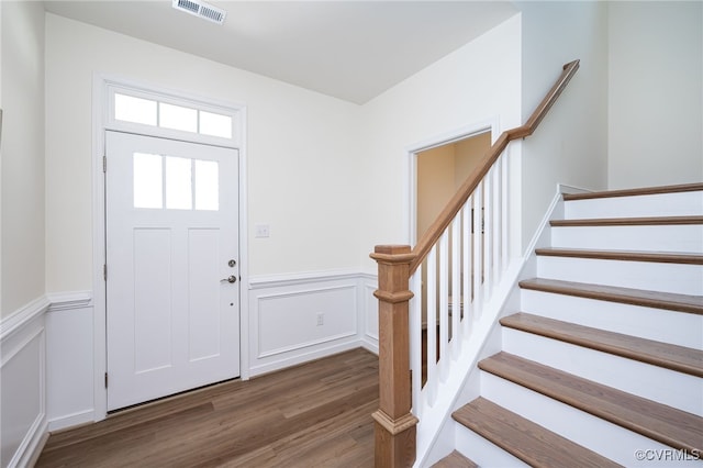 10698 Skippers St, Glen Allen, VA 23059 - entryway featuring wood finished floors, wainscoting, stairway, and a decorative wall