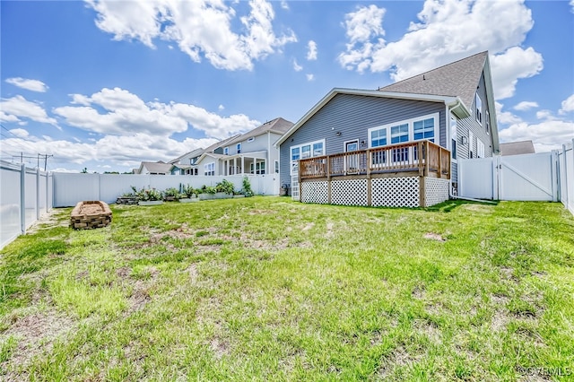 10698 Skippers St, Glen Allen, VA 23059 - rear view of property with a gate, a deck, a fenced backyard, a fire pit, and a shingled roof
