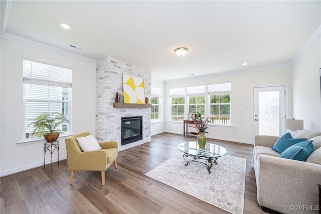 10698 Skippers St, Glen Allen, VA 23059 - living area with ornamental molding, wood finished floors, a fireplace, and recessed lighting