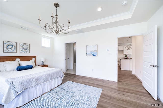 10698 Skippers St, Glen Allen, VA 23059 - bedroom featuring a chandelier, a tray ceiling, light wood-style floors, ornamental molding, and recessed lighting